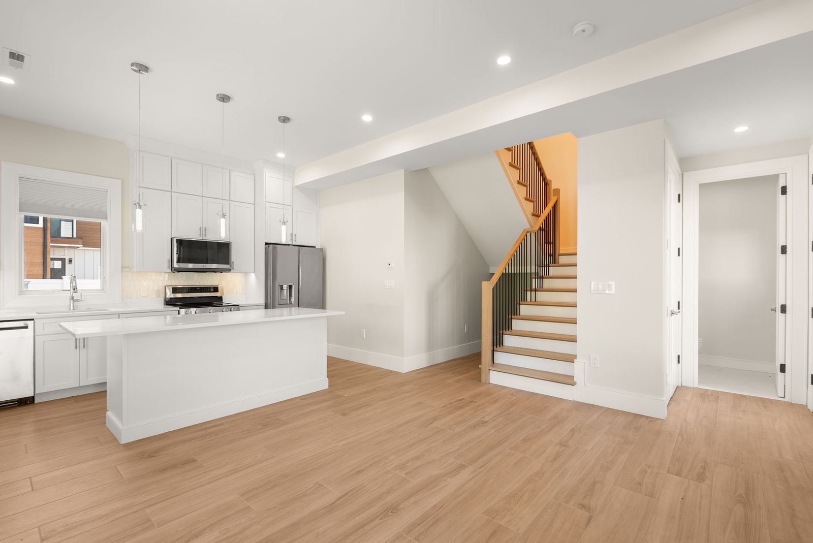 The lower-level kitchen and open stair at 82 Lexington St